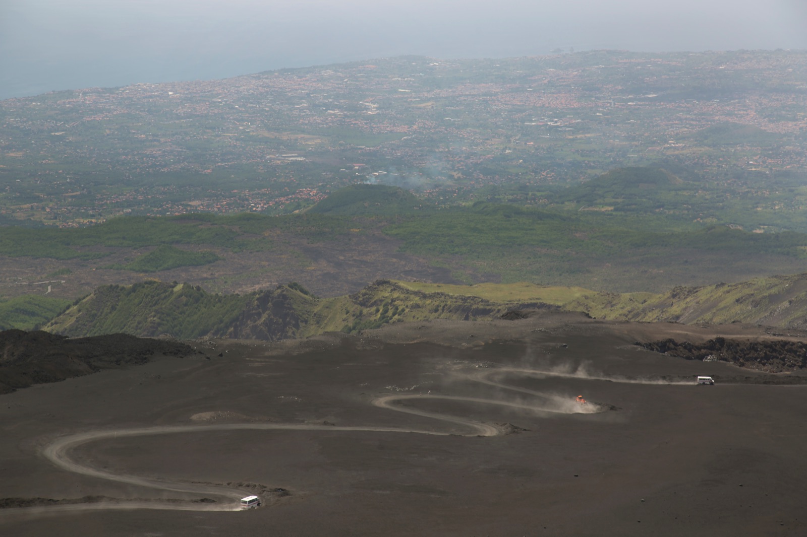 Four-wheel-drive vehicle on the volcanic track high on Mount Etna